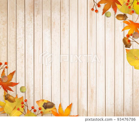 Fashionable wallpaper background material of autumn leaves and nuts on a warm white wood grain board 93476786