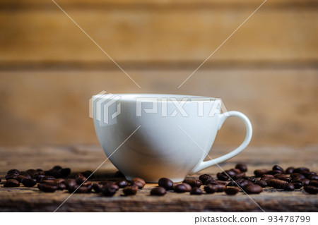 A cup of coffee with coffee bean on wooden background 93478799