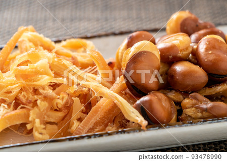 Assorted snacks. Saki squid and squid beans. Assorted snacks. Saki squid and squid beans. 93478990
