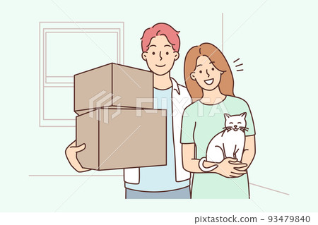 Happy couple with cat on moving day Happy couple with cat on moving day 93479840