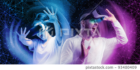 Banner of horror 3D simulation. Portraits of young had shocked screaming woman and man removing VR glasses. Black background and neon abstracts. The concept of metaverse and cyberspace 93480409