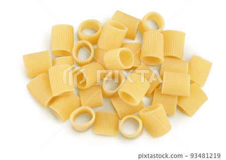 raw italian pasta isolated on white background. Mezze Maniche Rigate Bronze die. Top view. Flat lay raw italian pasta isolated on white background. Mezze Maniche Rigate Bronze die. Top view. Flat lay 93481219