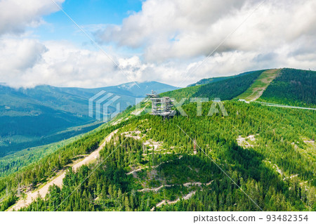 Aerial view of the worlds longest 721 meter suspension footbridge Sky bridge and observation tower the Sky walk in the forest, between mountains, Dolni Morava Ski Resort, Czech Republic.  93482354