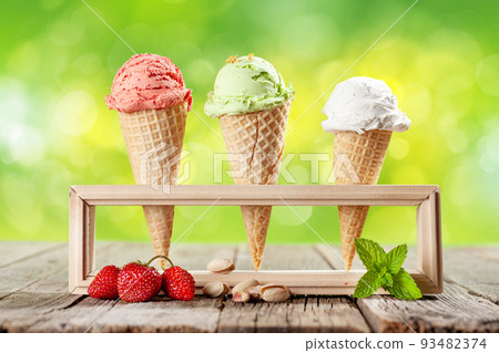Various ice cream in waffle cones 93482374
