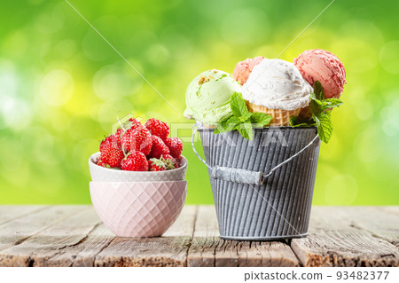 Various ice cream in waffle cones 93482377