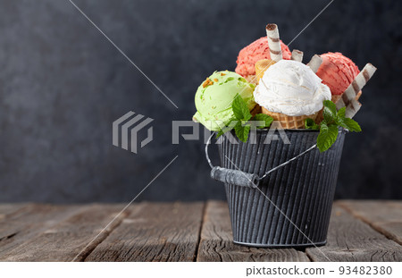 Various ice cream in waffle cones Various ice cream in waffle cones 93482380