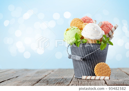 Various ice cream in waffle cones 93482382