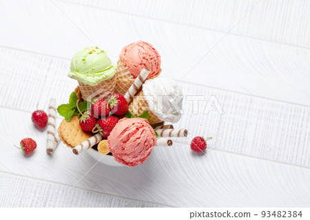 Various ice cream in waffle cones 93482384