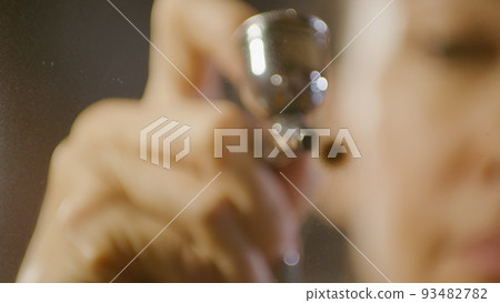 Woman artist learns to paint with airbrush with acrylic dye, paper and easel. Concept modern art, airbrushing, aerography, graffiti, aerosol spray Woman artist learns to paint with airbrush with acrylic dye, paper and easel. Concept modern art, airbrushing, aerography, graffiti, aerosol spray 93482782