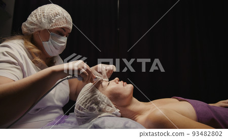 Woman cleansing facial in spa salon. Water oxygen face h2o2 small bubble facial rf lifting equipment skin care microdermabrasion machine Woman cleansing facial in spa salon. Water oxygen face h2o2 small bubble facial rf lifting equipment skin care microdermabrasion machine 93482802
