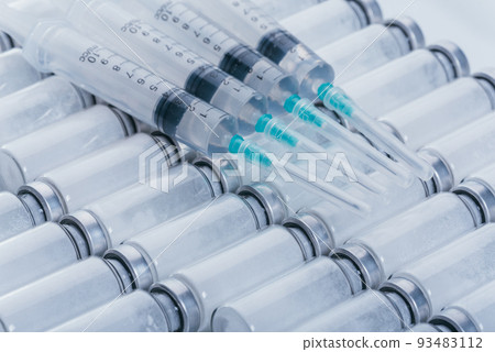 Medicine, Injection, vaccine and disposable syringe, drug concept. Sterile vial medical syringe needle. Glass medical ampoule vial for injection. Medicine, Injection, vaccine and disposable syringe, drug concept. Sterile vial medical syringe needle. Glass medical ampoule vial for injection. 93483112