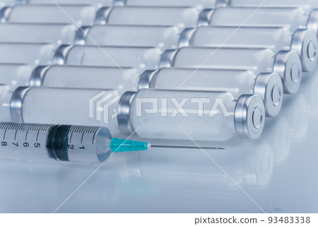 Medicine, Injection, vaccine and disposable syringe, drug concept. Sterile vial medical syringe needle. Glass medical ampoule vial for injection. Medicine, Injection, vaccine and disposable syringe, drug concept. Sterile vial medical syringe needle. Glass medical ampoule vial for injection. 93483338