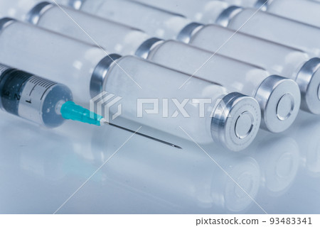 Medicine, Injection, vaccine and disposable syringe, drug concept. Sterile vial medical syringe needle. Glass medical ampoule vial for injection. Medicine, Injection, vaccine and disposable syringe, drug concept. Sterile vial medical syringe needle. Glass medical ampoule vial for injection. 93483341