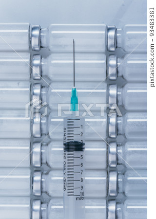 Medicine, Injection, vaccine and disposable syringe, drug concept. Sterile vial medical syringe needle. Glass medical ampoule vial for injection. Medicine, Injection, vaccine and disposable syringe, drug concept. Sterile vial medical syringe needle. Glass medical ampoule vial for injection. 93483381