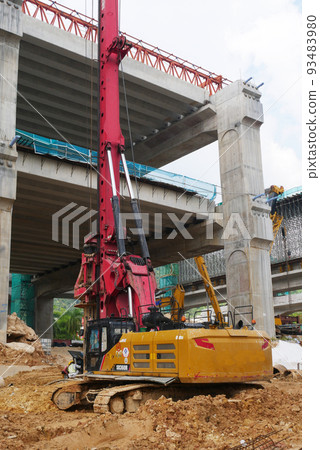 SELANGOR, MALAYSIA -JUNE 30, 2022: Bore pile rig machine at the construction site. The machine used to driven pile for building foundation work. Operated by skilled workers. Heavy machinery. 93483980