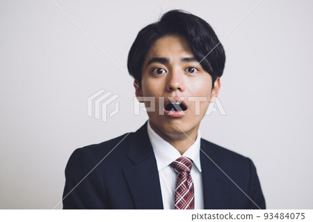 Surprised businessman in his twenties 93484075