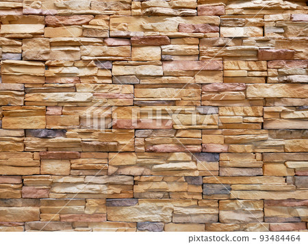 Artificial stone cladding. Designed to resemble real stone. Arranged vertically and attached to the wall with a special adhesive. Used as decoration on the walls of buildings. Artificial stone cladding. Designed to resemble real stone. Arranged vertically and attached to the wall with a special adhesive. Used as decoration on the walls of buildings. 93484464