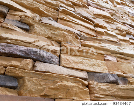 Artificial stone cladding. Designed to resemble real stone. Arranged vertically and attached to the wall with a special adhesive. Used as decoration on the walls of buildings. 93484467