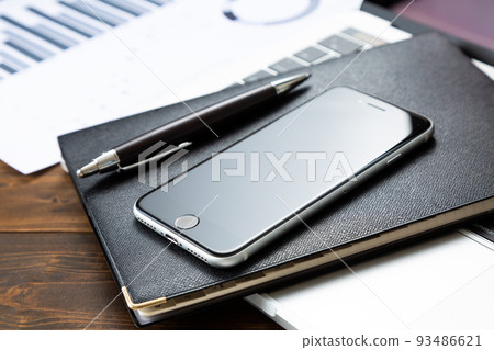 Hand holding a smartphone Hand holding a smartphone 93486621