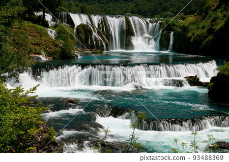 a magnificent waterfall called strbacki buk on the beautifully clean and drinking Una river in Bosnia and Herzegovina in the middle of a forest. a magnificent waterfall called strbacki buk on the beautifully clean and drinking Una river in Bosnia and Herzegovina in the middle of a forest. 93488369
