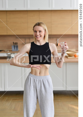 Woman on diet drinks water Woman on diet drinks water 93489569