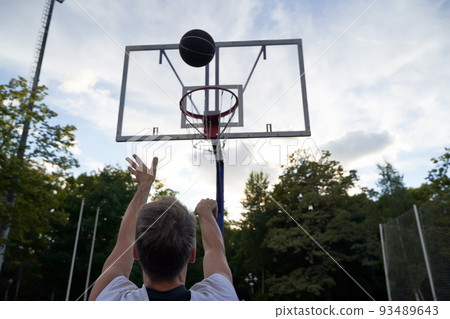 Man is throwing ball to the hoop. Training of basketball Man is throwing ball to the hoop. Training of basketball 93489643