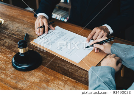 business people and lawyers discussing contract papers sitting at the table. Concepts of law, advice, legal services 93490028