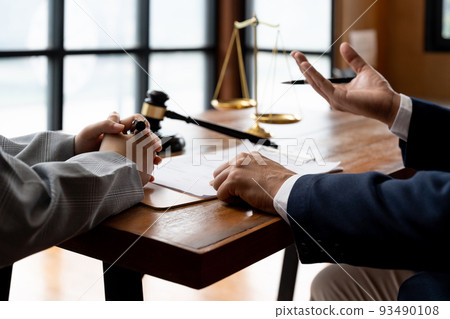 business people and lawyers discussing contract papers sitting at the table. Concepts of law, advice, legal services 93490108
