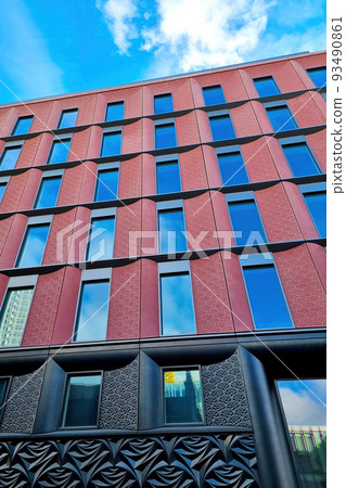 Beautiful modern building against the blue sky. Beautiful modern building against the blue sky. 93490861