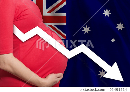 Australian pregnant woman on Australian flag background. Falling fertility rate in Australia 93491314