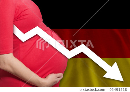 German pregnant woman on German flag background. Falling fertility rate in Germany German pregnant woman on German flag background. Falling fertility rate in Germany 93491318