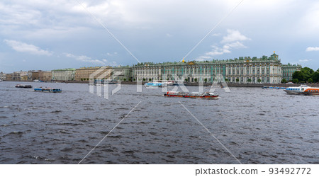 Tourist boats sail along the Neva River past the Winter Palace in St. Petersburg 93492772