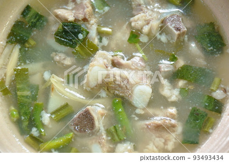 hot and spicy pork bone with tamarind and Thai herbs soup on bowl   93493434