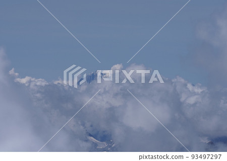 Misty Mont Blanc peak above clouds seen from Switzerland 93497297