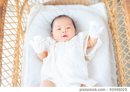 Baby with baby mittens 15 days old newborn 93498029