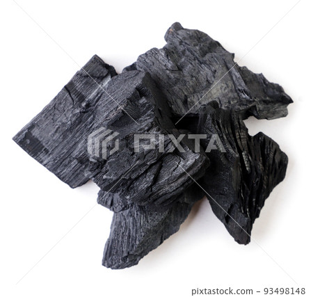 Pile of charcoal on a white background. Top view. Pile of charcoal on a white background. Top view. 93498148