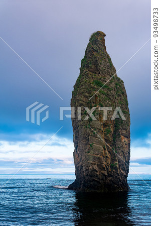seascape of Kunashir, ocean shore with a huge vertical rock in the water seascape of Kunashir, ocean shore with a huge vertical rock in the water 93498733