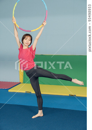 woman doing rhythmic gymnastics 93498933