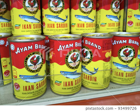 SELANGOR, MALAYSIA -JULY 6, 2022: Selective focused on sardine fish can. The fish has been processed, cook and packed in the can. Displayed on the rack for sale and tag with the price tag SELANGOR, MALAYSIA -JULY 6, 2022: Selective focused on sardine fish can. The fish has been processed, cook and packed in the can. Displayed on the rack for sale and tag with the price tag 93499726