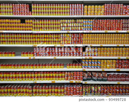 SELANGOR, MALAYSIA -JULY 6, 2022: Selective focused on sardine fish can. The fish has been processed, cook and packed in the can. Displayed on the rack for sale and tag with the price tag SELANGOR, MALAYSIA -JULY 6, 2022: Selective focused on sardine fish can. The fish has been processed, cook and packed in the can. Displayed on the rack for sale and tag with the price tag 93499728
