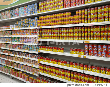 SELANGOR, MALAYSIA -JULY 6, 2022: Selective focused on sardine fish can. The fish has been processed, cook and packed in the can. Displayed on the rack for sale and tag with the price tag SELANGOR, MALAYSIA -JULY 6, 2022: Selective focused on sardine fish can. The fish has been processed, cook and packed in the can. Displayed on the rack for sale and tag with the price tag 93499731