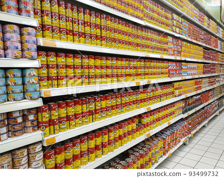 SELANGOR, MALAYSIA -JULY 6, 2022: Selective focused on sardine fish can. The fish has been processed, cook and packed in the can. Displayed on the rack for sale and tag with the price tag SELANGOR, MALAYSIA -JULY 6, 2022: Selective focused on sardine fish can. The fish has been processed, cook and packed in the can. Displayed on the rack for sale and tag with the price tag 93499732