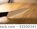 old broken ceramic knife on wooden table 93500343