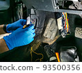 electrician master repairs cables in modern car 93500356
