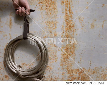 Hand is weighing bunch of metal wires. Taking copper or aluminum as non-ferrous metals scrap Hand is weighing bunch of metal wires. Taking copper or aluminum as non-ferrous metals scrap 93501561