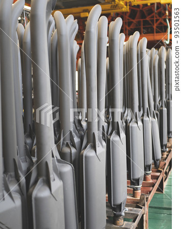 Tractor exhaust pipes at the factory workshop. Mufflers with exhaust pipes Tractor exhaust pipes at the factory workshop. Mufflers with exhaust pipes 93501563