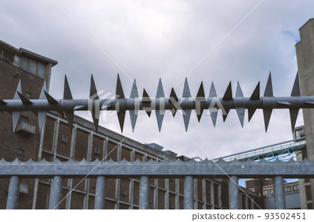 Element of industrial galvanized steel fence and spiked which increases the safety of the place Element of industrial galvanized steel fence and spiked which increases the safety of the place 93502451