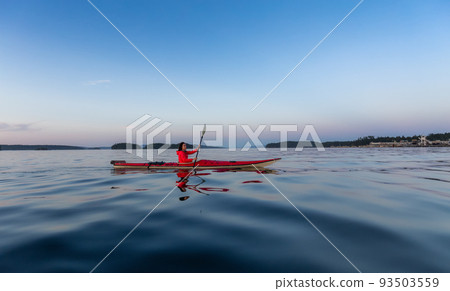 Adventurous Woman on Sea Kayak paddling in the Pacific Ocean Adventurous Woman on Sea Kayak paddling in the Pacific Ocean 93503559