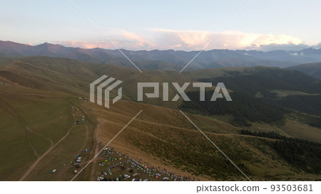 Red rays of the sun at sunset among the mountains Red rays of the sun at sunset among the mountains 93503681
