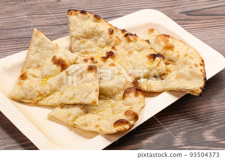 Indian tandoori bread - Butter naan Indian tandoori bread - Butter naan 93504373